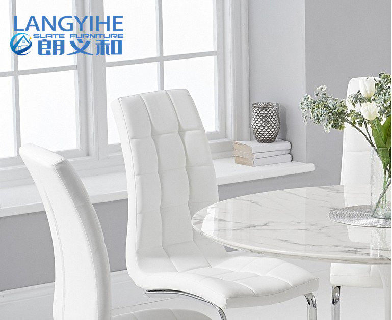 mesa de comedor redonda de mármol blanca del 120cm y tapizado cenando la silla